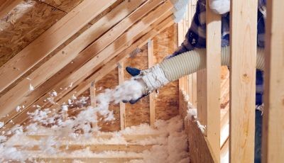 Professional spray foam insulation being applied in a residential attic in Austin, TX, improving energy efficiency and reducing air leakage.