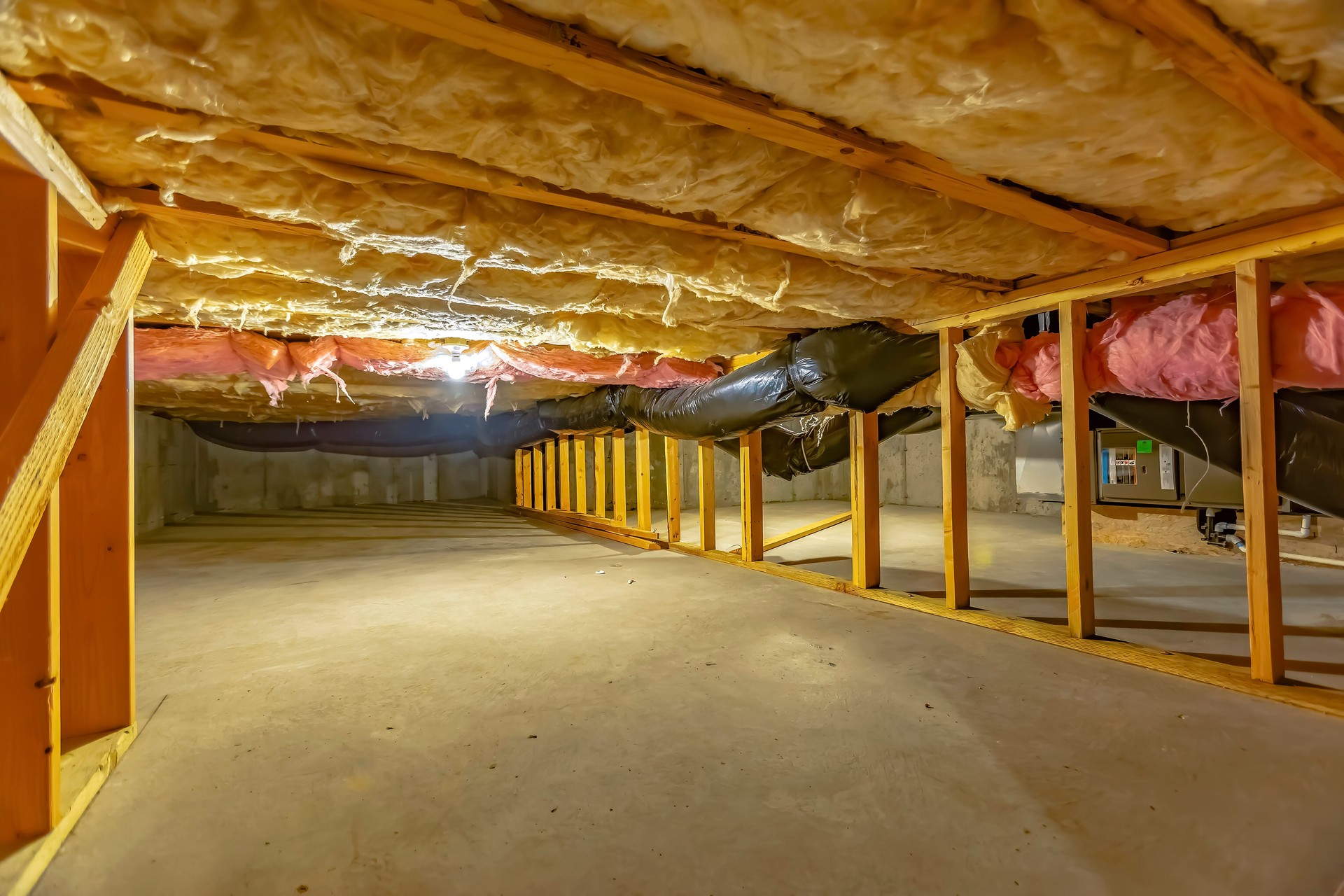 Professional spray foam insulation applied to a home’s interior for maximum energy efficiency.